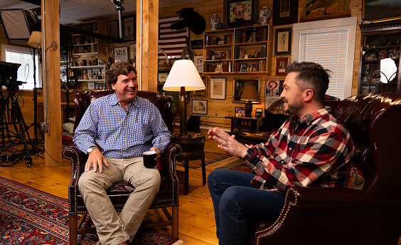Two men sitting in chairs